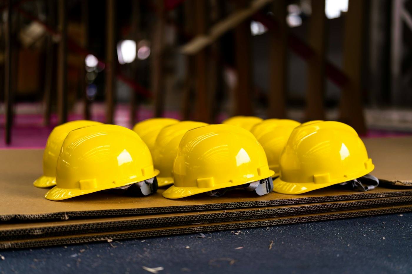 Row of yellow safety hard hats