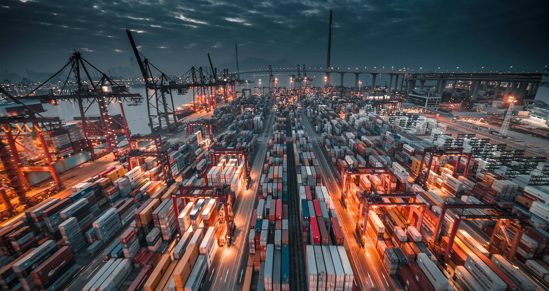 Container port at night with gantry cranes